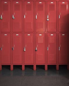 a row of red lockers in a room