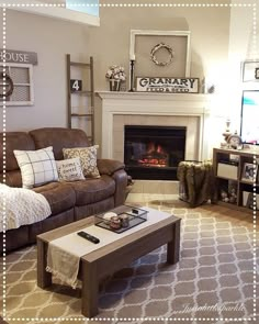 a living room filled with furniture and a fire place in the middle of the room