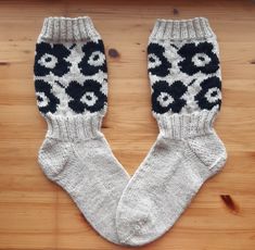 a pair of white socks with black and white designs