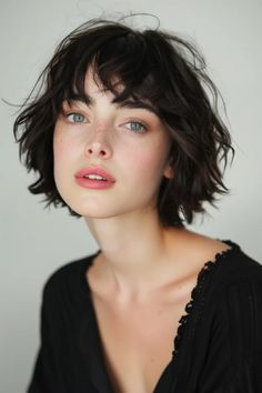 Woman with short wavy brunette hair, blue eyes, and freckles, wearing a black top against a gray background. Yourwifeknows Hair, Curtain Bangs Bob, Short Haircuts With Bangs, Haircut Inspo, Longer Pixie Haircut, Long Pixie Hairstyles, Choppy Bangs, Haircuts Ideas, Messy Pixie