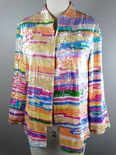 "This is a RARE and GORGEOUS vintage piece! It's fully embellished with colorful iridescent pastel sequins and accented with an embroidered bird on the back. It's in absolutely perfect condition! Bust - 40\" (with the one closure intact) Shoulders - 17\" hem to hem Sleeves - 20\" Length - 24\" Tag Size - US 10 All of my items come from a smoke-free and pet-free home. If you have any questions, please don't hesitate to ask!" Iridescent Sequin Fabric For Spring, Glamorous Multicolor Sequin Fabric For Spring, Spring Multicolor Sequin Fabric, Spring Embellished Multicolor Sequin Fabric, Embellished Multicolor Outerwear For Spring, Multicolor Embellished Outerwear For Spring, Iridescent Sequin, Checkered Jacket, Sequin Cardigan