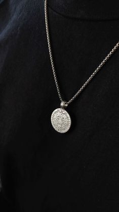 This necklace is composed of a big aztec calendar spinner coin pendant in silver filled brass, a very durable and fashionable piece that compliments any outfit. Perfect gift for him! Available in 3 chains: 1- Stainless steel ball chain 2-.Stainless steel box chain 3- Solid sterling silver 925 rolo chain 4- Stainless steel cuban chain ✺ Chain width: 2 mm ✺ Pendant length: 1.2 inch / 3 cm Available in various lengths. Measure your desired length and order accordingly.  How to find the perfect leng Sterling Silver Medallion Jewelry With Box Chain, Silver Chain Medallion Jewelry, Amulet Style Medallion Jewelry With Box Chain, Sterling Silver Amulet Medallion Necklace, Oxidized Stainless Steel Medallion Jewelry, Oxidized Stainless Steel Medallion Necklace, Sterling Silver Amulet Coin Necklace, Sterling Silver Coin Necklace With Oxidized Finish, Sterling Silver Amulet Medallion Necklace With Round Pendant