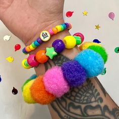 Rainbow Pom Pom clown kandi beaded bracelet set clowncore accessories jewelry  Handmade bracelet set of 3 with chunky rainbow Pom poms and fimo clay clown charm  Perfect accessory to add fun and color to your wardrobe!  *CLOWN BEAD MAY CHANGE TO HAPPY FACE BEADS DEPENDING ON AVAILABILITY! Tags; clown clowncheck clown aesthetic rave Y2K kidcore kandi cuff kandicore kandikid weirdcore whimsical jewelry rainbow bright fun jewelry Clown Kandi, Rainbowcore Fashion, Kidcore Accessories, Kidcore Jewelry, Kid Core Outfits, Glittery Jewelry, Decora Harajuku, Rainbow Pom Pom, Harajuku Decora