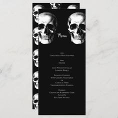 a black and white skull themed wedding menu with skulls on it's back side