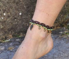 This listing is for one anklet. Beautiful macrame anklet. You can wear it alone or in combination with the barefoot sandals available in my shop (picture 2 and 4) https://www.etsy.com/listing/589470076/big-brass-flower-barefoot-sandals-green?ref=shop_home_active_2 This anklet is made with waxed polyester cord, antique bronze beads and charms and toho seed beads. They close with a lobster claw and on the other side a small chain allows to adjust the length of the anklet. The anklet comes in a bea Hippie Beaded Ankle Wrap Anklets, Handmade Bohemian Anklets With Ankle Strap, Bohemian Handmade Anklets With Ankle Strap, Adjustable Ankle Wrap Anklets For Festivals, Handmade Festival Anklets With Ankle Strap, Handmade Ankle Wrap Anklets For Festivals, Hippie Ankle Wrap Anklets For Festival, Bohemian Festival Anklets With Ankle Strap, Bohemian Ankle Strap Anklets For Festivals