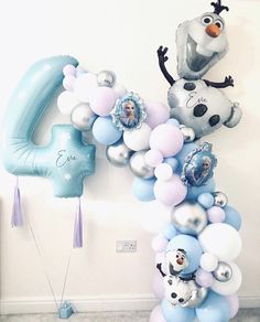 balloons are arranged in the shape of numbers for a frozen world themed birthday party at home