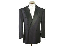 "Size: 42S / 42 Short US/UK This European vintage double-breasted dark purple tuxedo jacket has wide black peak lapels and padded shoulders and closes in the front with one black silk button (six in total show on the front). The retro formal dinner jacket has three pockets on the front and is crafted from a high-quality lightweight polyester-wool blend fabric with a diamond weave. The tux jacket is lined in a black satin viscose fabric (with four inner pockets). Note that this is a \"short\" size, which means the sleeves and the jacket length itself are slightly shorter than a regular 42. Exact measurements below. Brand label: Scherfig (Germany) Material: Polyester, Wool Condition: Excellent (Professionally Cleaned ... soft and supple, with no stains, tears, wear spots, or weaknesses in th Black Double Breasted Suit With Double Button For Evening, Black Double Breasted Suit For Evening, Double-breasted Long Sleeve Tuxedo For Business, Black Double Breasted Long Sleeve Suit For Evening, Long Sleeve Double-breasted Business Tuxedo, Black Double Breasted Suit With Long Sleeves For Evening, Black Double-breasted Evening Suit, Double Breasted Tuxedo Suit With Long Sleeves, Classic Double-breasted Evening Blazer