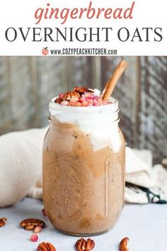 a jar filled with overnight oats sitting on top of a table next to some pecans