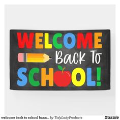 a welcome back to school sign with pencils and an apple