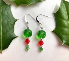 Handmade earrings with green and red glass beads Perfect and fun accessory for the holiday season! Green Dangle Earrings For Holidays, Bead Christmas Earrings, Christmas Green Earrings With Dangling Beads, Handmade Green Beaded Christmas Earrings, Red Christmas Earrings With Colorful Beads, Green Dangle Christmas Jewelry, Holiday Earrings, Beaded Earring