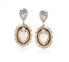 Italian Cameo Shell Heart Earrings in 18kt Gold Over Sterling Silver, pre-owned. These two-tone pear shape accent with drop or dangle Cameo earrings. THe earrings feature both brushed, polished 18kt gold over sterling silver. The dimensions are 25 x 18 mm Cameo shell 'burning hearts' or 'heart of fire', enhanced with .30 ct. t.w. CZs. Crafted in Italy. Clip/post, shell cameo earrings. CZ weights are diamond equivalents. Clip-style post Do you have a burning heart...?! Feed the flame! In celebrat Gold Cameo Earrings For Gift, Luxury Oval Cameo Earrings, Luxury Gold Cameo Earrings, Carnelian Cameo Jewelry Gift, Gold Cameo Earrings For Collectors, Cameo Earrings, Fire Heart, Sacred Heart, Gold Details