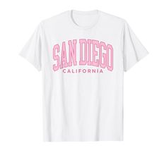 PRICES MAY VARY. Vintage San Diego Preppy Varsity retro throwback classic California t-shirt. Add this San Diego California outfit to your vacation beachwear collection. Preppy Varsity aesthetic, surf, sunshine souvenir t-shirt for boys & girls. Retro vintage San Diego CA family vacation souvenir apparel in a Preppy Varsity retro throwback style with Pink Arched Text graphic. Great trendy mens shirt design and cute womens tops and kids surf clothing, for trips to San Diego. Lightweight, Classic Varsity Aesthetic, Preppy Kids Outfits, Preppy Kids, Preppy Tops, California Outfits, Surf Clothing, Beachwear Collection, Text Graphic, Surf Outfit