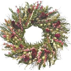 a wreath with pink and white flowers on it