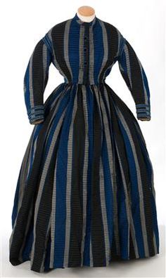 Silk taffeta dress, 1860s. IMATEX, register number 11452. Closure has three decorative black velvet buttons trimmed with blue silk. The waist of the skirt is gathered all the way around the waist of the bodice. 19th Century Dresses, Taffeta Dress