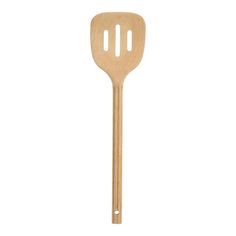 a wooden spatula with two holes in it