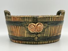 an old wooden bracelet with two hearts on it