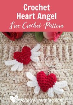 the crochet heart angel keychain is shown on top of a knitted rug