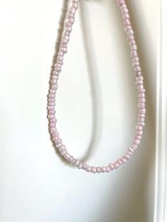 handmade pink seed bead necklace * approximately 15 inches but feel free to message me to request a custom length! * beads are made of glass * perfect for summer! 💗 30% of profits donated 💗 ships in environmentally friendly packaging 💗 free shipping over $35 💗 comes with a free sticker Seed Bead Necklace Choker, Y2k Beaded Necklace, Y2k Jewelry, Bead Choker, Pink Y2k, Seed Bead Necklace, Pink Beads, Necklace Choker, Beaded Choker