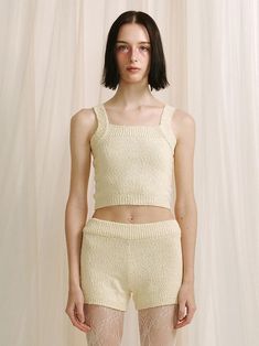 Designer fashion, Seoul-fully created | W Concept Fitted Knit Tank Crop Top, Fitted Tank Knit Crop Top, Fitted Cropped Knit Tank Top, Ribbed Cropped Tank Top In Beige, Chic Sleeveless Crop Top For Loungewear, Chic Knit Tank Crop Top, Fitted Textured Knit Top For Loungewear, Seamless Cropped Knit Tank Top, Beige Cropped Knit Top