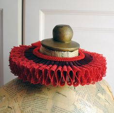 This Elizabethan ruff collar is made with a combination of sheer organza with delicate lace edge. Finished off with bright red braided trimming around the neck. You may choose a combination of burgundy organza with bright red lace (pictured), total black or total white from the drop-down menu. This ruff is completely hand-sewn and it closes at the back with satin ribbon. Measurements :  1.5 inch (4 cm) tall 2.5 inches (6,5 cm) wide Need this in another color or size? Just send me a message for a Diy Clown Ruffle Collar, Elizabethan Ruff Diy, Jester Neck Ruffle, Diy Neck Ruffle Collar Clown, Elizabethan Ruff, Elizabethan Ruffle Collar, Cirque Vintage, Ruff Collar, Total Black