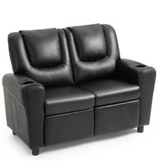 a black leather couch with two recliners on it's back and armrests