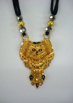 "20kt ETHNIC TRIBAL GOLD PENDANT BEADS NECKLACE FROM RAJASTHAN INDIA. GREAT HANDMADE DESIGN GOLD PENDANT STRING WITH 10pc GOLD BEADS & BLACK GLASS BEADS IN TRADITIONAL STYLE. necklace length can be adjust by back thread knot. Gross weight - 18.5 grams Pendant Height max. - 4.2 cm (1.6\") Pendant Width max.- 2.5 cm (1\") Material - 20kt yellow gold." Gold Dual-tone Temple Necklace For Puja, Yellow Gold Kundan Necklace For Puja And Festivals, Bollywood Style Dual-tone Gold Temple Necklace, Navratri 22k Gold Kundan Necklace, 22k Gold Kundan Necklace For Puja And Festivals, Gold Dual-tone Bollywood Necklace, Bollywood Style Gold Dual-tone Necklace, Traditional Gold Bridal Necklace With Dual-tone, Traditional Gold Dual-tone Bridal Necklace