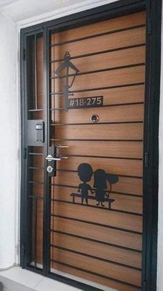 an image of a door that has been painted with the silhouettes of two people