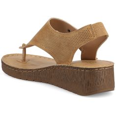 The McKell from Journee Collection is the perfect summer sandal. With its breezy and gorgeous perforated faux leather material and unique toe knot on its flip-flop style this shoe is everything you need. It also features a cute double buckle stitching accents and a wedge heel. At Journee Collection our sandal styles are going to be perfect for any occasion. Whether that be a formal business or casual dress these sandals will be a perfect match. Summer Toe Post Wedge Sandals With Arch Support, Slingback Wedge Sandals With Arch Support For Vacation, Casual Synthetic T-strap Wedge Sandals, Slingback Wedge Sandals With Arch Support For Beach, Summer Synthetic Wedge Sandals With Leather Footbed, Summer Wedge Sandals With Leather Footbed, Leather Footbed Toe Post Wedge Sandals For Summer, Summer Toe Post Wedge Sandals With Leather Footbed, Brown Wedge Sandals With Ortholite Insole For Summer