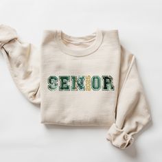 Class of 2025 Shirt, 2025 Graduation Shirt, Senior 2025 Shirt, Family Shirts Graduation, Senior Mom 2025, Matching Senior ABOUT: :) This pre-shrunk, classic fit sweatshirt is made with air-jet spun yarn for a soft feel and reduced pilling. :) Pre-shrunk :) Classic fit with no center crease :) 1x1 athletic rib knit collar with spandex :) Air-jet spun yarn with a soft feel and reduced pilling :) Double-needle stitched collar, shoulders, armholes, cuffs, and hem: 50% preshrunk cotton, 50% polyester Senior T Shirts 2023, Senior Class Of 2024 Shirt Ideas, Pre-shrunk Long Sleeve Shirt For College, Class T Shirts, Senior Crewneck, Custom Print Long Sleeve Top For College, Custom Print Long Sleeve College Tops, Senior Shirts Diy, Senior Sweatshirts Ideas Diy