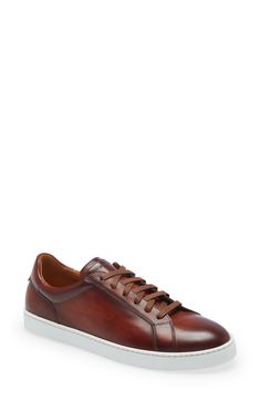 The rich glow of burnished Italian leather elevates a charming handcrafted sneaker in a sporty low-top silhouette. Leather upper and lining/rubber sole Made in Spain Store Shoes, Italian Leather, Cognac, Low Top, Shoes Jewelry, Top Sneakers, Rubber Sole, Leather Upper, Spain