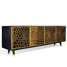 a black and gold sideboard with an animal print design on the front, two doors and three drawers