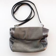 Unique And Oh So Chic! Designed And Handmade By Daniella Lehavi, Israel. Sold At Anthropologie. Minimalist Crossbody Mini Roll Top Bag. Remove The Strap To Use As A Clutch. Grey Suede And Gunmetal Metallic Leather. Open Top Rolls Down And Holds In Place With Magnets. Love The Design Of This Gorgeous And Understated Bag. Excellent Condition Used Gently, Only Once. Measures Approx: 7w X 6.5h X 3d Smoke / Pet Free Home. Silver Leather Clutch Shoulder Bag, Silver Leather Evening Bag For Everyday Use, Silver Leather Evening Bag, Silver Leather Clutch Evening Bag, Versatile Leather Shoulder Bag With Fold Over Clasp, Silver Leather Clutch Bag, Silver Leather Crossbody Evening Bag, Silver Leather Evening Bag With Detachable Strap, Evening Crossbody Flap Bag With Gunmetal Hardware