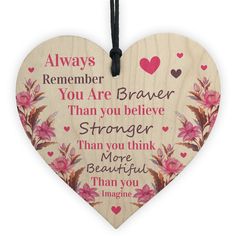 a heart shaped wooden plaque with the words, always remember you are braver than you believe