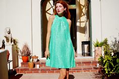 Unleash your inner Factory Girl in this amazing 1960s party dress! This dress features a chic tent cut with a mock neck. The fabric is a beautiful green with silver polka dots. It is fully lined. A metal zipper closes up the back. Great vintage condition! Fits up to a 40 inch bust 35 inches long Shown on a size extra small In person shopping available at our downtown Los Angeles showroom. Mod Spring Party Dress, Mod Style Spring Party Dresses, Mod Style Party Dresses For Spring, Summer Party Dresses In Mod Style, Go Go Dress, 1960s Party, Gogo Dress, Mock Neck Dress, Tent Dress