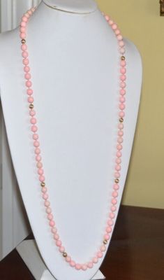 This is a beautiful coral necklace from a local estate. This necklace shows no signs of use or age. It was probably only worn a couple of times. The necklace has a total length of 37 inches. Each coral bead is approximately 9mm in diameter and individually knotted. Every 8 beads, there is a textured 14K gold spacer bead (10 gold beads in total). This is a refined & elegant necklace. The pink color is amazing. The necklace weighs 101 grams. Buyer pays shipping, $8 in USA. Thank you. Coral Necklace, Elegant Necklace, 14k Gold Necklace, Pink Coral, Coral Beads, Elegant Necklaces, Fine Jewellery Necklace, Gold Beads, Spacer Beads