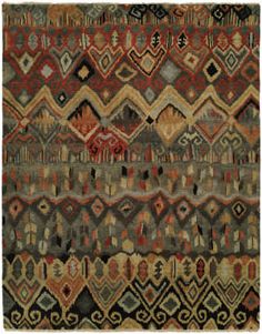 an old rug with many different colors and patterns