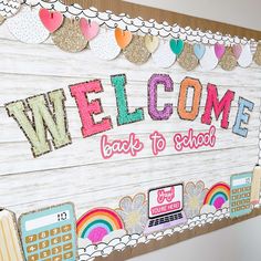 a bulletin board with the words welcome back to school written in large letters on it