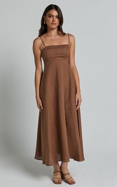 Elevate your summer wardrobe with the Brette Midi Dress in Tobacco. This stunning linen look dress features a flattering sweetheart neckline and stylish strappy details, making it perfect for both casual occasions and special events. The fit and flare silhouette accentuates your curves while providing a comfortable and breezy feel. Made from high-quality linen fabric, this sleeveless dress is ideal for staying cool on those hot days. Whether you're heading to brunch or a beach party, the Brette Dress Linen, Linen Dresses, Fit And Flare Dress, Beach Party, Summer Wardrobe, Sweetheart Neckline, Flare Dress, Linen Fabric, Midi Length