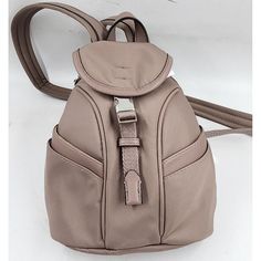 Calvin Klein Shay Nylon Mini Backpack Women'S Os Cocoa Front Buckle Zip Around~ Calvin Klein Shay Nylon Mini Backpack Women's Os Cocoa Front Buckle Zip Around Retail $148.00 Introducing The Calvin Klein Shay Mini Backpack In Cocoa. This Stylish Backpack Features A Triangle Shape With A Buckle And Zip Closure, And A Shoulder Strap For Easy Carrying. The Exterior Is Made Of A Blended Fabric With A Matte Finish And Colorblock Pattern, While The Lining Is Made Of Polyester. The Backpack Include Calvin Klein Bags Backpacks, Stylish Backpack, Calvin Klein Bag, Stylish Backpacks, Backpack Straps, Triangle Shape, Mini Backpack, Womens Calvin Klein, Silver Hardware