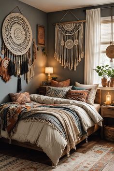 a bed room with a neatly made bed next to a window and hanging decorations on the wall