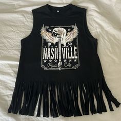 This Is A Brand New And Never Worn Sleeveless T Shirt. It Has A Nashville Graphic On It. No Tears Or Stains. Amazon Purchase, So No Brand On It. Size Small Spring Concert Sleeveless Vest, Spring Sleeveless Top For Concerts, Sleeveless Spring Concert Top, Sleeveless Vest For Spring Concert, Black Sleeveless T-shirt For Spring, Summer Concert Sleeveless Tank Top, Sleeveless T-shirt For Summer Concerts, Summer Concert Sleeveless T-shirt, Trendy Sleeveless Tank Top For Concert