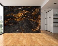 an empty room with wood floors and black marble wallpaper