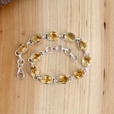 Citrine Bracelet, Sterling Silver Citrine Bracelet, Dainty Wristband Citrine Bracelet, Oval Cut Stone Citrine Handmade Bracelet Jewelry Gift Stone Name:- Citrine Weight (Approx.):- 14.50 Gram (According to the Stone) Full Length:- 8 Inch (Adjustable) Stone Length:- 6 Inch  Width:- 0.31 Inch Height:- 0.16 Inch Stone Size (Approx.):- 10 x 8 mm Oval Total Number of Stones:  11 Stone Setting: Bezel Setting Metal: 925 Sterling Silver Finish: Silver High Polish GN-BR-1015 Adjustable Oval Crystal Bracelet Gift, 11 Stone, Citrine Bracelet, Bracelet Dainty, Bracelet Sterling Silver, Handmade Bracelet, Bracelet Jewelry, Stone Settings, Oval Cut