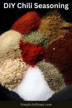 different types of seasoning in a bowl with the words diy chili seasoning