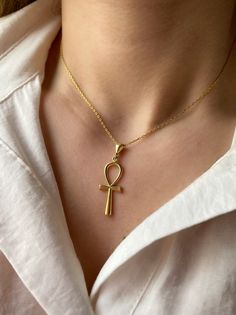 "It can be layered with other necklaces. 18K gold plated 925 sterling Silver necklace. It comes in our branded jewelry box and jewelry cleaning cloth, making it a great gift for her. The Ankh is one of the most popular symbols from ancient Egypt, known as \"the key of life\" or the \"cross of life\". Egyptians believed that one's earthly journey was only part of an eternal life, the ankh symbolizes both mortal existence and the afterlife.  It is a very nice option for those looking for a meaning Gold Plated Cross Pendant Charm Necklace, Gold-tone Pendant Necklace For Gift, Spiritual Gold Plated Cross Pendant Necklace, Gold Plated Cross Pendant Necklace Spiritual Style, Gold Plated Cross Pendant Necklace With Spiritual Style, Gold Plated Cross Pendant Jewelry With Adjustable Chain, Plated Pendant Necklaces As Gifts, Gold Plated Adjustable Chain With Cross Pendant, Spiritual Cross Pendant Necklaces For Gift