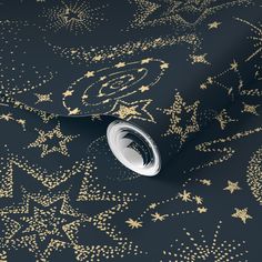 gold stars and snowflakes on black wrapping paper