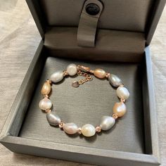 This beautiful Freshwater pearl bracelet ranges between 9-10mm in size and consists of beautiful and lustrous pearls in AAAA+ quality. All pearls in this bracelet are round and are strung with silk thread and double-knotted between each pearl. Known as the 'icon' of cultured pearls, Freshwater pearls have graced the necks, ears, fingers, and wrists of women for decades. Huge Tomato imports their Freshwater pearls from the Freshwater rs of Japan, grown in the Pinctada fucata oyster. All of our Fr Gift Pearl Bracelet With High Luster Round Beads, Gift Pearl Bracelet With High Luster, High Luster Pearl Bracelet With Round Beads As Gift, Rose Gold Pearl Bracelet With Round Beads, High Luster Pearl Bracelet Gift, Baroque Bracelet, Pearl Bracelet Gold, Cultured Pearl Bracelet, Buy Pearls