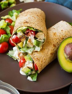 an avocado and salad wrap on a plate