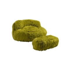 a green chair and ottoman sitting next to each other