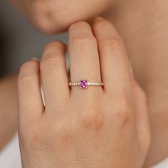 An engagement ring made of 14K solid gold with a natural hot pink Ceylon sapphire unheated and untreated oval cut on top, with side diamonds on the band. It has a comfort fit, so you can wear it everyday. 100% handcrafted. D E T A I L S ● Metal: 14K solid gold ● Gemstone: Pink Sapphire, unheated and untreated oval cut, Diamonds ● Gemstone's weight: Sapphire 0.39ct, Diamonds 0.08ct, color G, clarity SI H O W ∙ T O ∙ O R D E R Choose from the drop-down menus of the available options (Ring size) and leave us a note for any special requirements. G I F T S All our pieces are delivered beautifully packaged and gift ready. P R O D U C T I O N ∙ T I M E * S H I P P I N G Please keep in mind that each item is handcrafted, and we need 5 days at least for its production. If you need your order on a s Oval Pink Sapphire Jewelry For Anniversary, Oval Pink Sapphire Ring For Wedding And Anniversary, Oval Brilliant Cut Pink Sapphire Ring, Pink Sapphire Ring In Yellow Gold With Round Cut, Yellow Gold Pink Sapphire Ring With Round Cut, Oval Pink Sapphire Ring With Prong Setting, Sapphire Ring Engagement, Pink Sapphire Ring Engagement, Daily Wear Jewellery